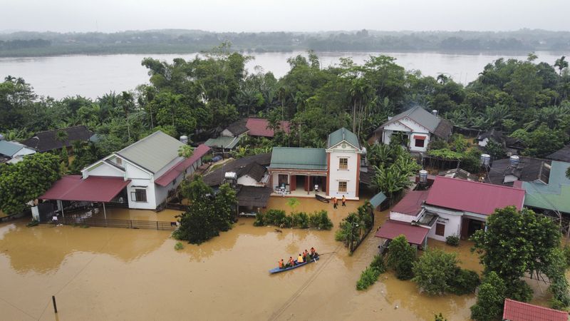 Flood triggered by Typhoon Yagi submerges houses in Phu Tho province, Vietnam Monday, Sept. 9, 2024. (Ta Van Toan/VNA via AP)