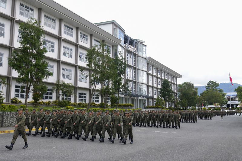 Cadets of the Philippine Military Academy march in formation at Fort Gregorio Del Pilar in Baguio, northern Philippines on Thursday, Aug. 29, 2024. (AP Photo/Aaron Favila)