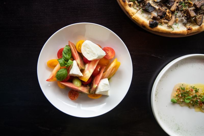 Tre Vele Caprese with mozzarella di Bufala, heirloom tomatoes, basil, olive oil, and aged balsamic. (Mia Yakel for The Atlanta Journal-Constitution)