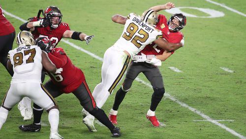Bucs quarterback Tom Brady gets sacked in the fourth quarter of Tampa Bay's loss to the Saints last Sunday in Tampa.