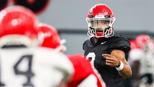 Georgia quarterback Jamie Newman (9) directs the offense during a Bulldogs practice session Friday, Aug. 28, 2020, in Athens. Newman transferred to Georgia from Wake Forest. (Photo by Tony Walsh)