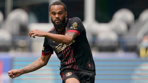 Atlanta United defender Anton Walkes (right) kicks the ball during the first half Sunday, May 23, 2021, against Sounders in Seattle. (Ted S. Warren/AP)