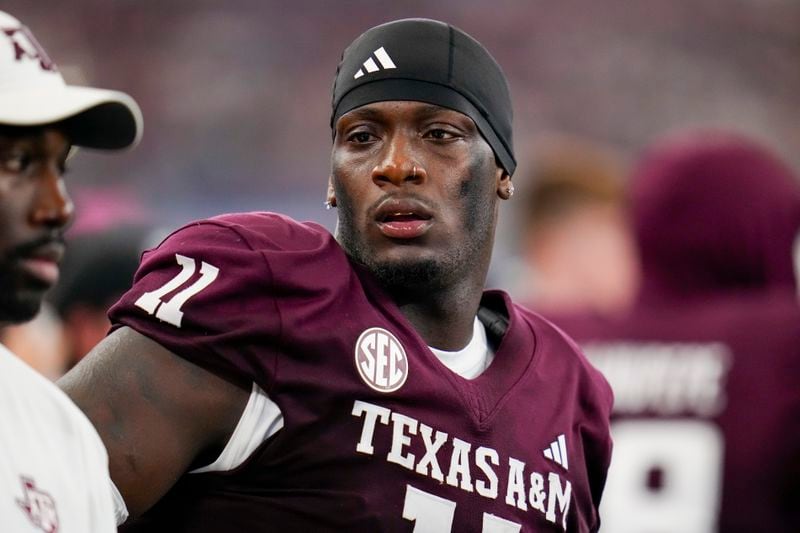 Texas A&M defensive lineman Nic Scourton looks on from the bench during the second half of an NCAA college football game, Saturday, Sept. 28, 2024, in Arlington, Texas. Texas A&M won 21-17. (AP Photo/Julio Cortez)