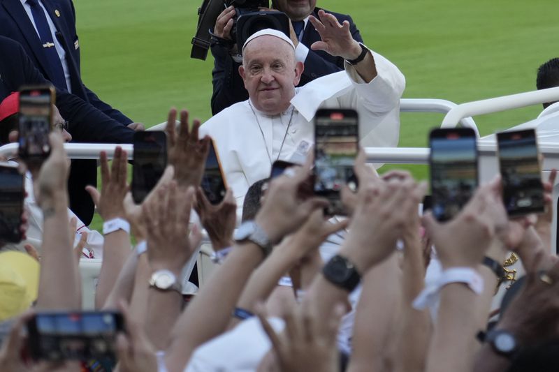 Pope Francis arrives to lead the holy mass at Gelora Bung Karno Stadium in Jakarta, Indonesia, Thursday, Sept. 5, 2024. (AP Photo/Achmad Ibrahim, Pool)