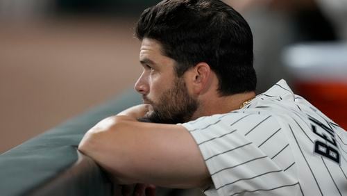 Chicago White Sox's Andrew Benintendi looks out from the dugout during the ninth inning of a baseball game against the New York Mets on Saturday, Aug. 31, 2024, that saw the team tie the franchise season record of 106 losses in Chicago. (AP Photo/Charles Rex Arbogast)