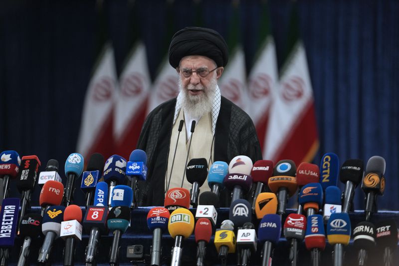 Iranian Supreme Leader Ayatollah Ali Khamenei speaks after casting his vote during the presidential election in Tehran, Iran, Friday, June 28, 2024. Iranians were voting Friday in a snap election to replace the late President Ebrahim Raisi, killed in a helicopter crash last month, as public apathy has become pervasive in the Islamic Republic after years of economic woes, mass protests and tensions in the Middle East. (AP Photo/Vahid Salemi)