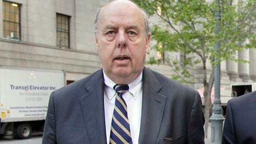 In this April 29, 2011, file photo, Attorney John Dowd walks in New York. Dowd, one of the key lawyers in President Donald Trump’s corner, navigated a popular United States senator through crisis, produced a damning investigative report that drove a baseball star from the game and, early in his career, took on organized crime as a Justice Department prosecutor. Dowd assumed a more prominent place on the legal team after another lawyer, Marc Kasowitz, took a reduced role. (AP Photo/Richard Drew, File)