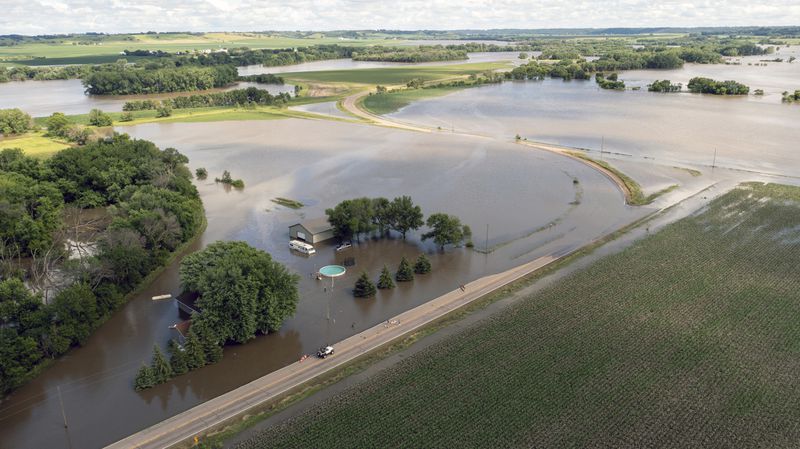 South Cedar St. is underwater after days of heavy rain led to flooding in the area, Saturday, June 22, 2024 south of Canton, S.D. (AP Photo/Josh Jurgens)