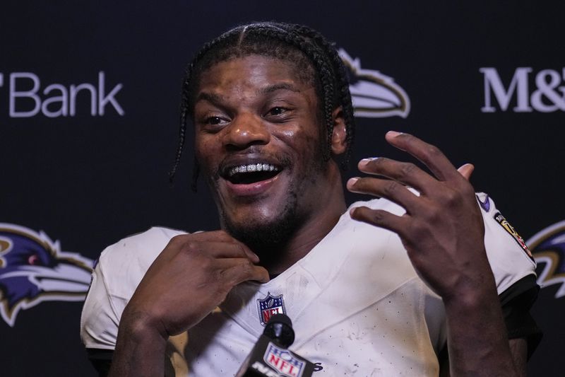 Baltimore Ravens quarterback Lamar Jackson speaks to reporters following an NFL football game against the Cincinnati Bengals, Sunday, Oct. 6, 2024, in Cincinnati. The Ravens won 41-38 in overtime. (AP Photo/Carolyn Kaster)