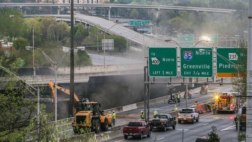 Crews work Friday March 31, 2017, on the portion of I-85 that collapsed during the Thursday evening rush hour.