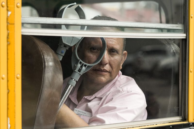 A Nicaraguan citizen rides on a bus after being released from a Nicaraguan jail and landing at the airport in Guatemala City, Thursday, Sept. 5, 2024. (AP Photo/Moises Castillo)