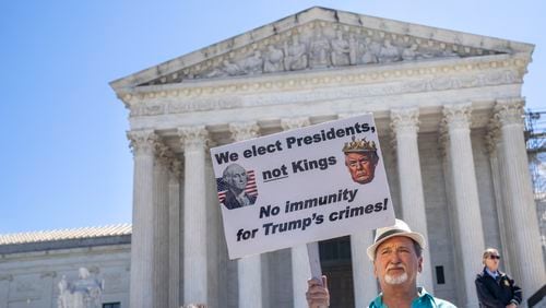 Gary Roush, of College Park, Maryland, protested outside of the U.S. Supreme Court on Monday after the decision on presidential immunity was announced.
