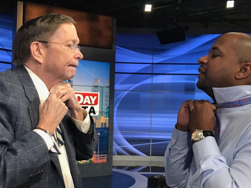 Dick Williams putting on his signature bow tie, with Tharon Johnson wearing one to in honor of William's final taping March 8, 2019 of "The Georgia Gang" on Fox 5.