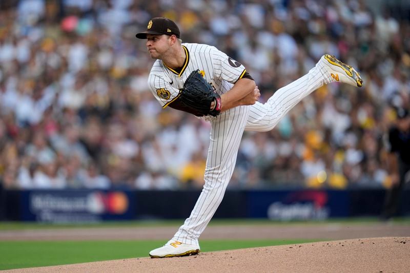 San Diego Padres starting pitcher Michael King throws to a Atlanta Braves batter during the first inning in Game 1 of an NL Wild Card Series baseball game Tuesday, Oct. 1, 2024, in San Diego. (AP Photo/Gregory Bull)