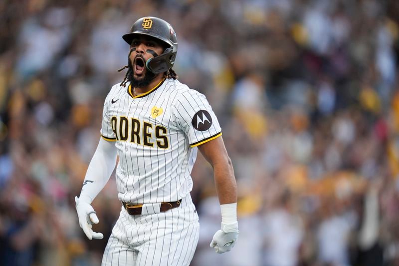 San Diego Padres' Fernando Tatis Jr. celebrates after hitting a two-run home run during the first inning in Game 1 of an NL Wild Card Series baseball game against the Atlanta Braves, Tuesday, Oct. 1, 2024, in San Diego. (AP Photo/Gregory Bull)