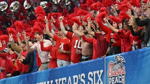 Ole Miss fans cheer during the second half in 2023 Chick-fil-A Peach Bowl at Mercedes-Benz Stadium, Saturday, December 30, 2023, in Atlanta. Ole Miss won 38-25 over Penn State. (Hyosub Shin / Hyosub.Shin@ajc.com)