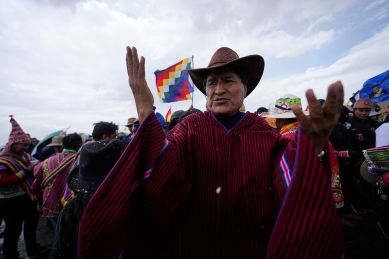 Former President Evo Morales, center, marches to La Paz with supporters to protest current President Luis Arce, near El Alto, Bolivia, Sunday, Sept. 22, 2024. (AP Photo/Juan Karita)