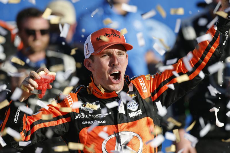 Ross Chastain celebrates in Victory Lane after winning a NASCAR Cup Series auto race at Kansas Speedway in Kansas City, Kan., Sunday, Sept. 29, 2024. (AP Photo/Colin E. Braley)