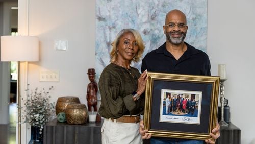 Jo and Al Vivian, daughter-in-law and son of Civil Rights leader C.T. Vivian, pose for a portrait at their home in Atlanta on Monday, April 8, 2024. (Arvin Temkar / arvin.temkar@ajc.com)
