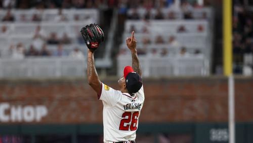 Atlanta Braves relief pitcher Raisel Iglesias reacts after recording the save for the Braves win against the Philadelphia Phillies during the ninth inning at Truist Park, Thursday, August 22, 2024, in Atlanta. The Braves won 3-2. (Jason Getz / AJC)
