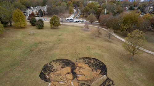 A portrait of Rosalynn and Jimmy Carter made from mulch, peat moss and stones sits on a hill in Freedom Park in Atlanta on Wednesday, Nov. 22, 2023.   (Ben Gray / Ben@BenGray.com)