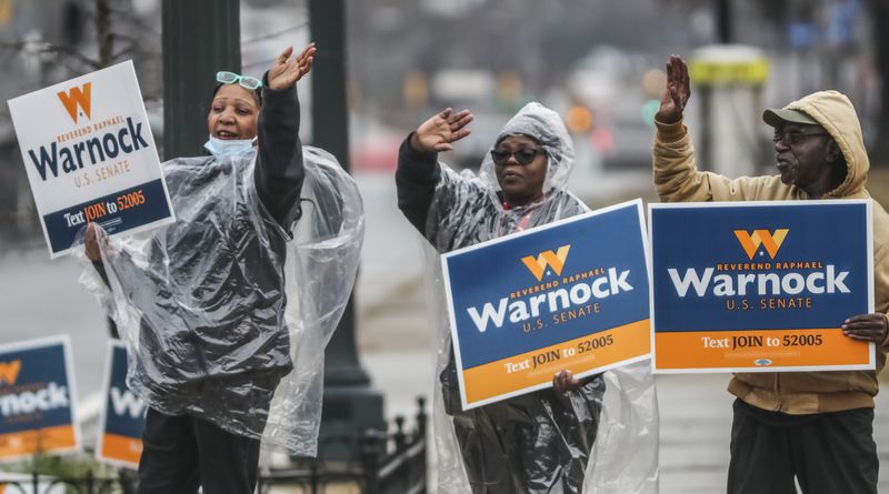 Supporters of Democrat Raphael Warnock campaigned at the C.T. Martin Natatorium and Recreation Center on Dec. 6, 2022. (John Spink / John.Spink@ajc.com)

