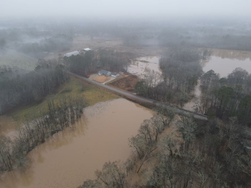 This aerial view shows flooding in January 2024 on and near Roy Barnes' property, according to Clithon Rice, a nearby HOA president who opposes the rezoning of the Barnes' property for a new residential development. Contributed