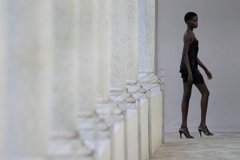 A model wears a creation as part of the Alberta Ferretti Spring Summer 2025 collection, that was presented in Milan, Italy, Tuesday, Sept. 17, 2024. (AP Photo/Luca Bruno).