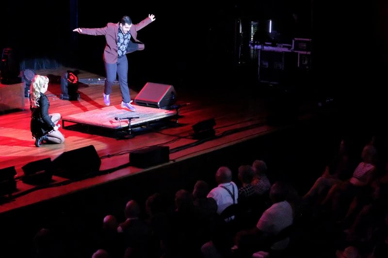 A dancer performs on stage at the Ryman Auditorium during a concert by the band Postmodern Jukebox in Nashville, Tenn., on July 30, 2024. (AP Photo/Luis Andres Henao)