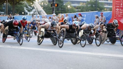 Men’s wheelchair division at the start of the 55th running of the Atlanta Journal-Constitution Peachtree Road Race in Atlanta on Thursday, July 4, 2024.   (Miguel Martinez / AJC)