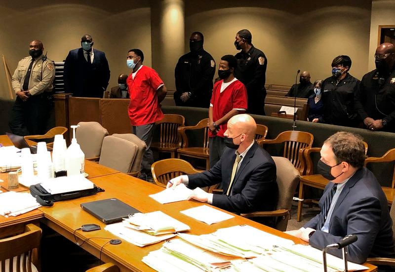 FILE - From left, Justin Johnson and Cornelius Smith appear before a judge during a court hearing related to the fatal shooting of rapper Young Dolph on Friday, Feb. 11, 2022, in Memphis, Tenn. (AP Photo/Adrian Sainz, File).