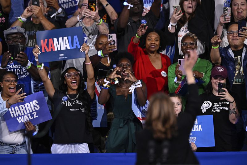 Supporters cheer as Democratic presidential nominee Vice President Kamala Harris waves during a campaign event, Thursday, Sept. 12, 2024, in Greensboro, N.C. (AP Photo/Matt Kelley)