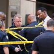 Atlanta Mayor Andre Dickens, second from right, and Atlanta Police Chief Darin Schierbaum work at the scene where multiple people were injured during a shooting at Peachtree Center in downtown Atlanta. (Miguel Martinez/Atlanta Journal-Constitution via AP)