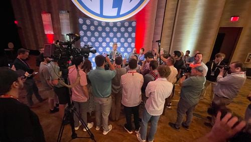 Georgia quarterback Carson Beck found himself engulfed by reporters in the main media room at The Omni Hotel Downtown Dallas during SEC Football Media Days in Dallas on Tuesday, July 16, 2024. (Photo by Chip Towers/ctowers@ajc.com)