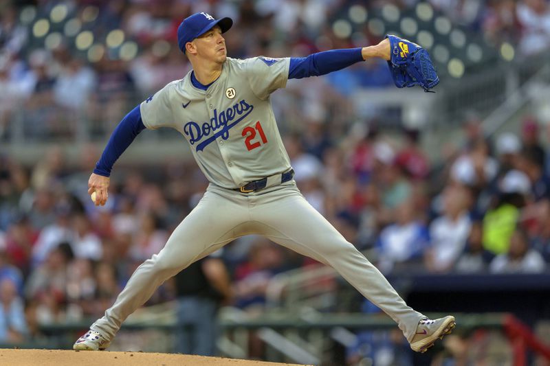 Los Angeles Dodgers pitcher Walker Buehler throws in the first inning of a baseball game against the Atlanta Braves, Sunday, Sept. 15, 2024, in Atlanta. (AP Photo/Jason Allen)