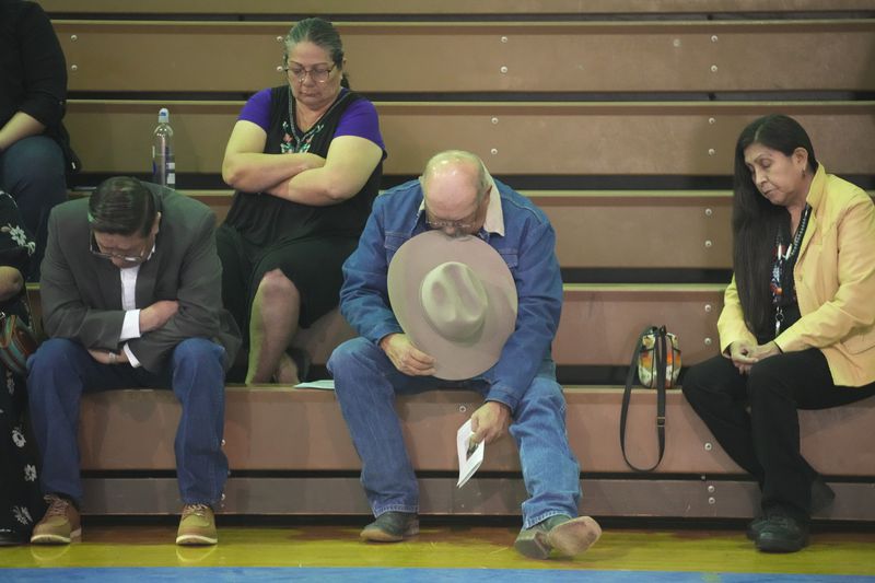 Tribal members gather in a gymnasium to pay their respects to Marvin Cota, who died from cancer, during a memorial service in Owyhee, Nev., on March 14, 2024, on the Duck Valley Indian Reservation that straddles the Nevada-Idaho border. (AP Photo/Rick Bowmer)