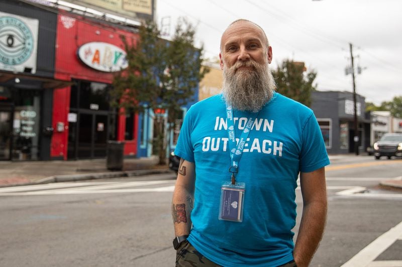 Michael Nolan, case manager for nonprofit Intown Cares, stands for a portrait in the heart of East Atlanta Village on Oct. 12, 2023. Nolan will be spearheading a new pilot program in the neighborhood to make connections with individuals experiencing homelessness and help get them housed. (Riley Bunch/riley.bunch@ajc.com)