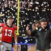 Georgia's quarterback Stetson Bennett (13) and head coach Kirby Smart celebrate their victory during the 2023 College Football Playoff National Championship game at SoFi Stadium, Monday, Jan. 9, 2023, in Inglewood, California. (Hyosub Shin / Hyosub.Shin@ajc.com)