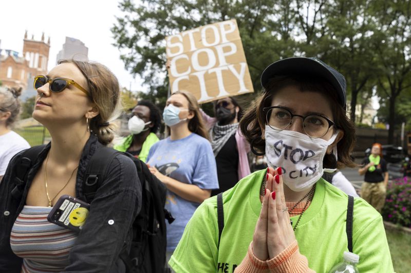 Opponents of an under-construction law enforcement training center known to some as "Cop City," protest at City Hall in Atlanta on Monday, Sept. 16, 2024. (Arvin Temkar/Atlanta Journal-Constitution via AP)