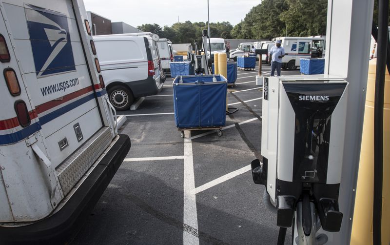 Mail delivery vehicles are seen at a post office on Thursday, Sept. 5, 2024, in Athens Ga. (AP Photo/Ron Harris)