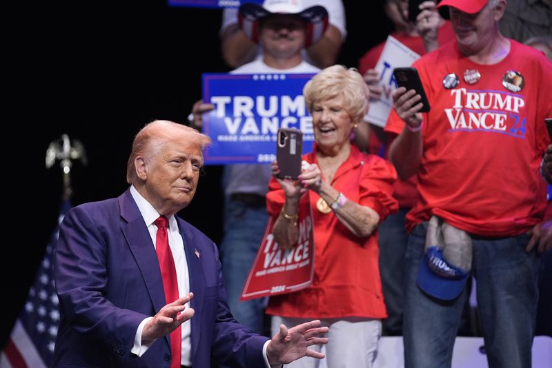 Republican presidential nominee former President Donald Trump arrives to speak about the tax code and manufacturing at the Johnny Mercer Theatre Civic Center, Tuesday, Sept. 24, 2024, in Savannah, Ga. (AP Photo/Evan Vucci)