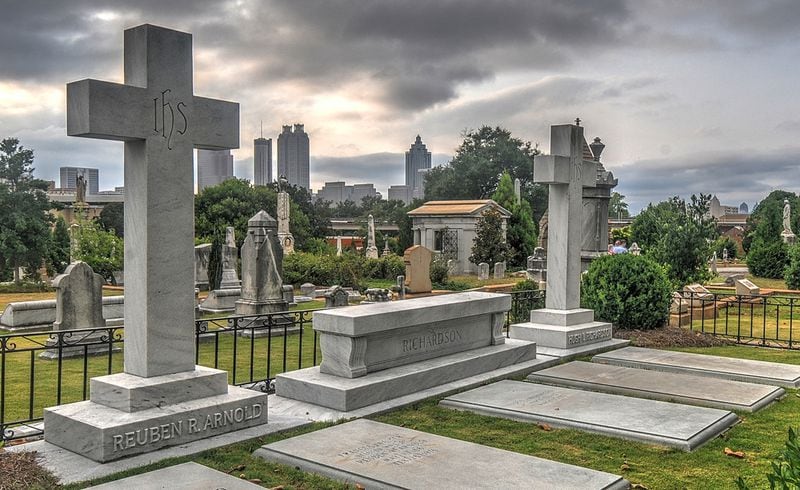 Late evening sun sets on Oakland Cemetery after a historic tour of the cemetery lead by volunteers on July 19, 2014. The 48 acre cemetery sits near downtown Atlanta and is bordered by Memorial Drive, Oakland Avenue, Boulevard and the rail line running along Decatur Street. The cemetery (originally six acres) has grown since its opening and host the remains of many of Atlanta's leaders and political figures. (CHRIS HUNT/SPECIAL)