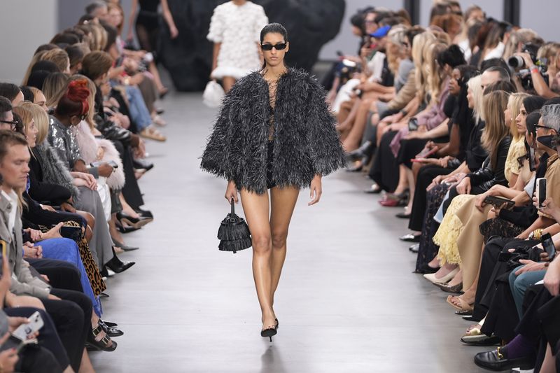 A model walks the runway during the Michael Kors Collection spring/summer 2025 fashion show as part of New York Fashion Week, Tuesday, Sept. 10, 2024, in New York. (AP Photo/Pamela Smith)