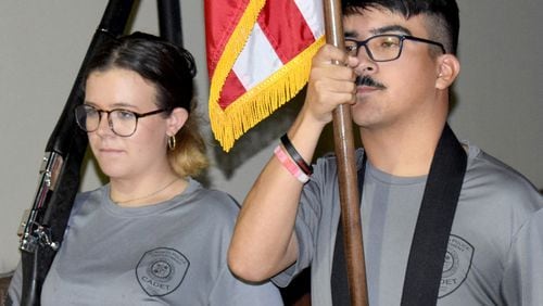 Kirsten Combs (left) and Kamran Padilla practice drills during a recent Acworth police cadets meeting.