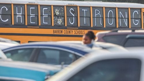 A bus outside Apalachee High School in Winder, Ga., as classes resumed after a Sept. 4 shooting there left four people dead. (John Spink/The Atlanta Journal-Constitution)