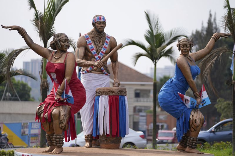 Sculptures dressed with the Rwandan Patriotic Front political party colours at Sonatube in Kigali, Rwanda, Thursday, July 11, 2024. Rwandans are voting Monday in an election that will almost certainly extend the long rule of Kagame, who is running virtually unopposed after three decades in power in the eastern African nation. (AP Photo/Brian Inganga)