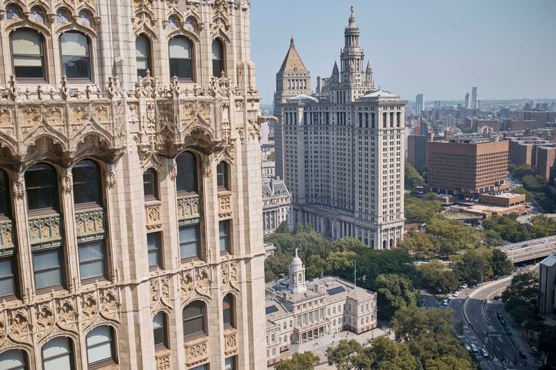 Cars move along Park Row street next to the New York City Hall, bottom center, Friday, Sept. 13, 2024, in New York. (AP Photo/Andres Kudacki)