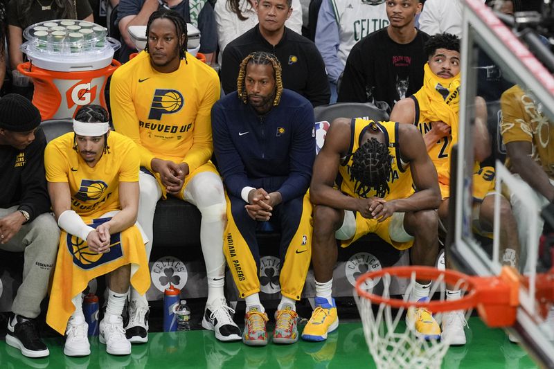 Members of the Indiana Pacers watch from the bench during the second half of Game 2 of the NBA Eastern Conference basketball finals against the Boston Celtics, Thursday, May 23, 2024, in Boston. (AP Photo/Michael Dwyer)