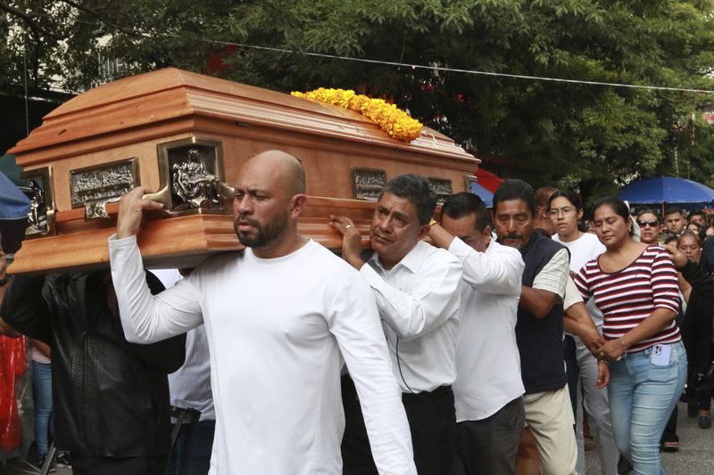 Relatives of slain Mayor Alejandro Arcos carry his coffin during his funeral service, one week after he took office, in Chilpancingo, Guerrero state, Mexico, Monday, Oct. 7, 2024. (AP Photo/Alejandrino Gonzalez)