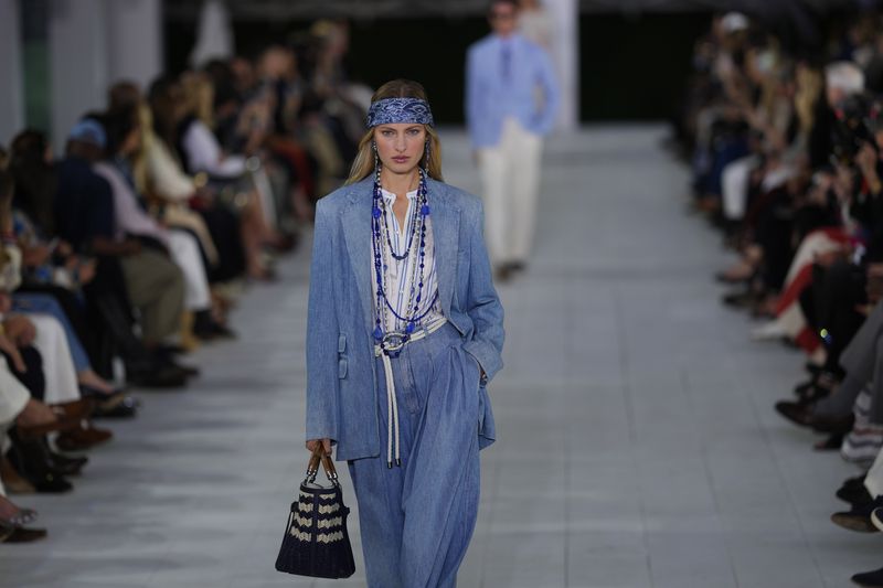 A model walks the runway during the Ralph Lauren Spring/Summer 2025 fashion show as part of New York Fashion Week on Thursday, Sept. 5, 2024, at Khalily Stables in Bridgehampton, N.Y. (Photo by Charles Sykes/Invision/AP)